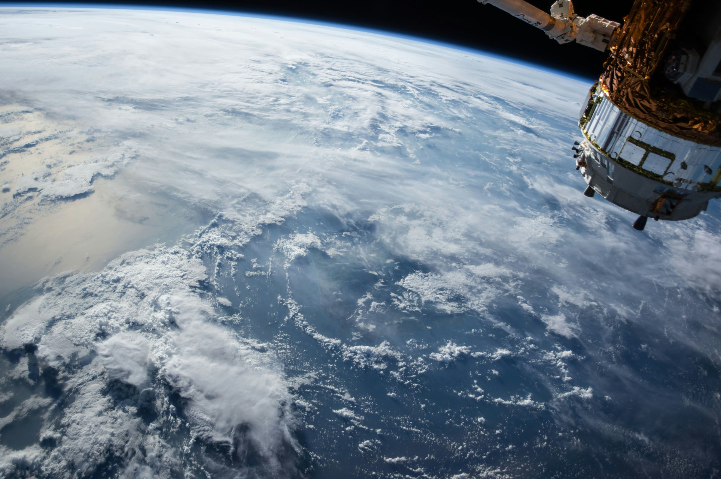Earth and a satellite seen from the International Space Station